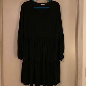 Knee length long sleeve black dress